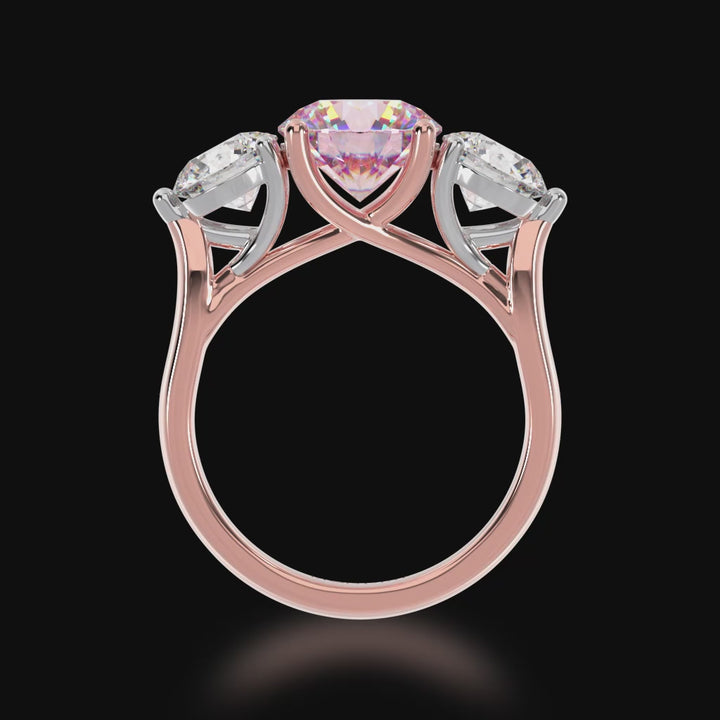 Trilogy round brilliant cut pink sapphire and diamond ring on rose gold band 3d video