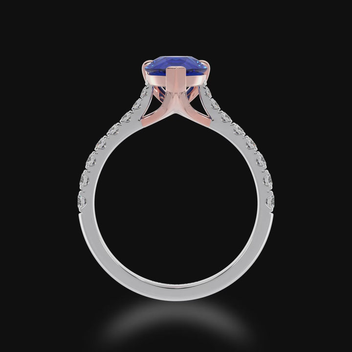 Pear shaped blue sapphire solitaire ring with diamond set band 3d view