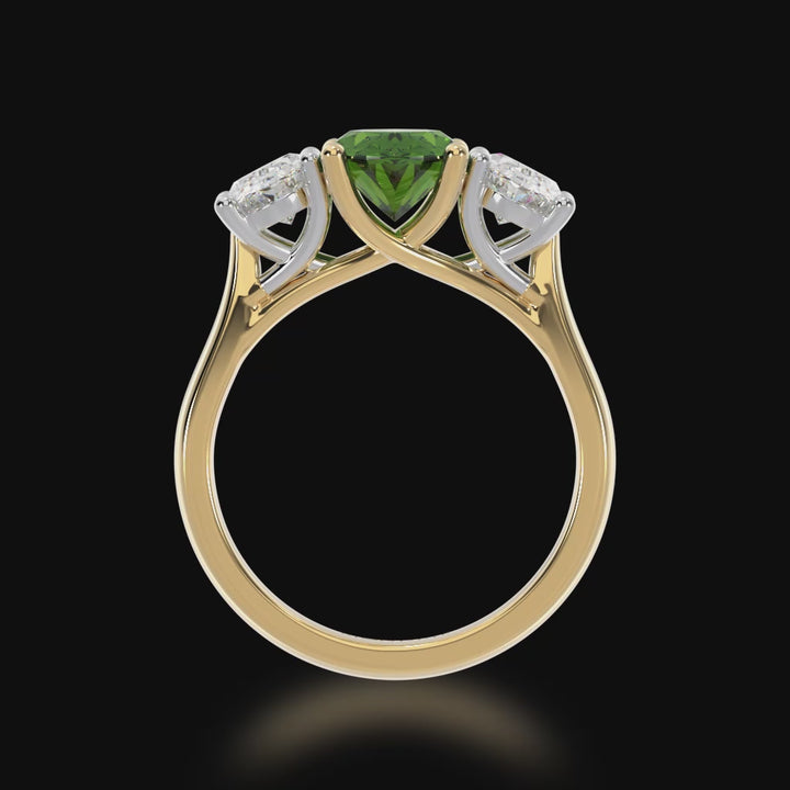 Trilogy oval cut green sapphire and diamond ring on a yellow gold band 3d video