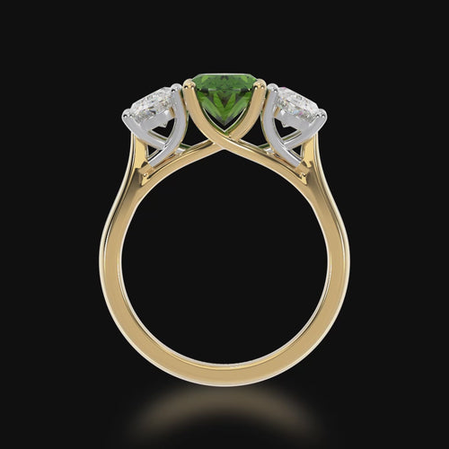 Trilogy oval cut green sapphire and diamond ring on a yellow gold band 3d video.