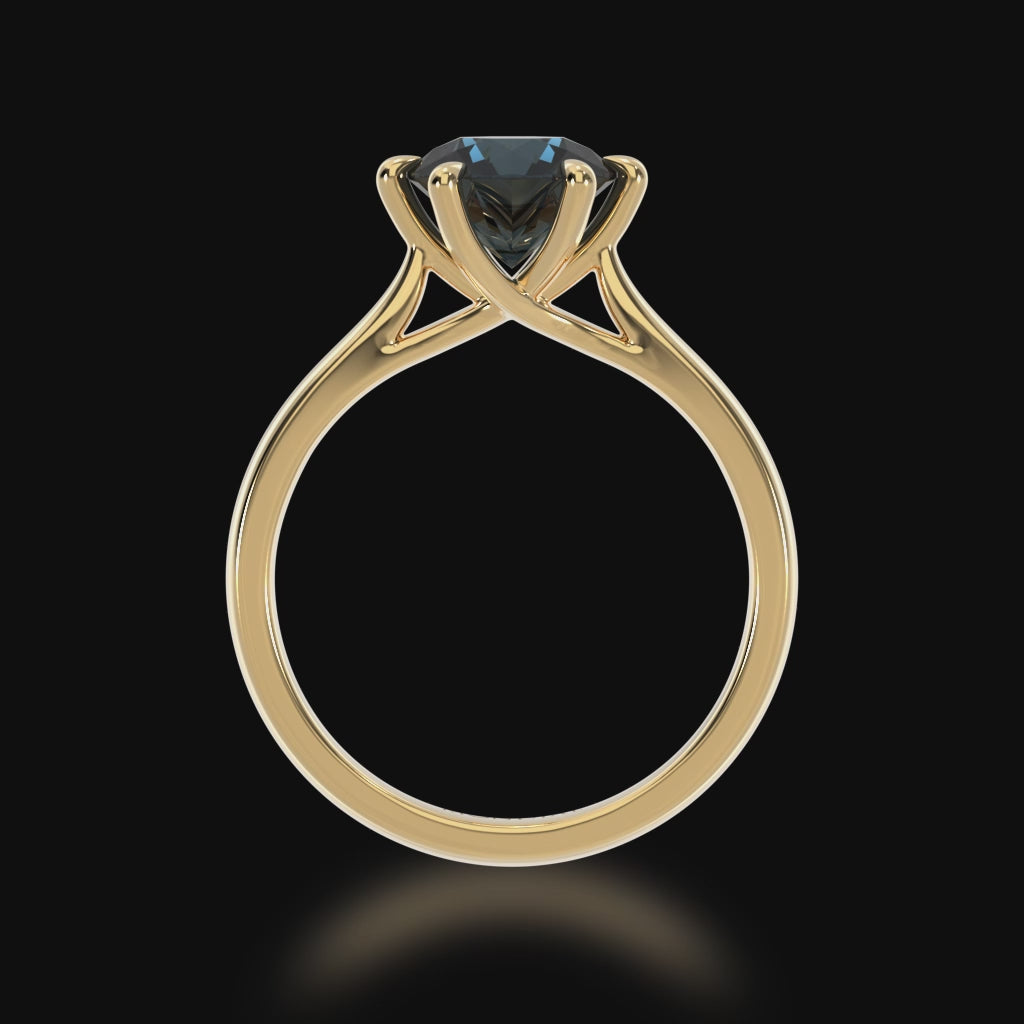 Brilliant cut black sapphire solitaire on a yellow gold band 3d video