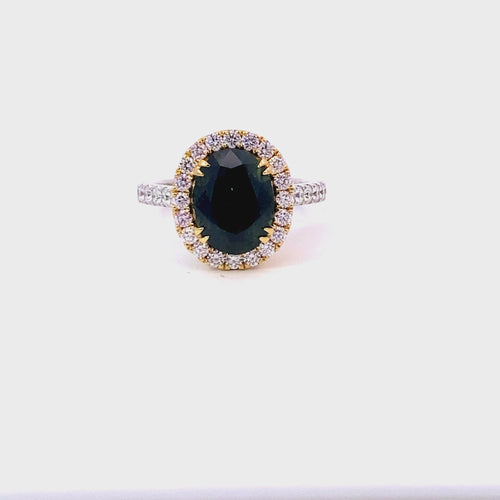 Oval cut green sapphire diamond halo ring with diamond band