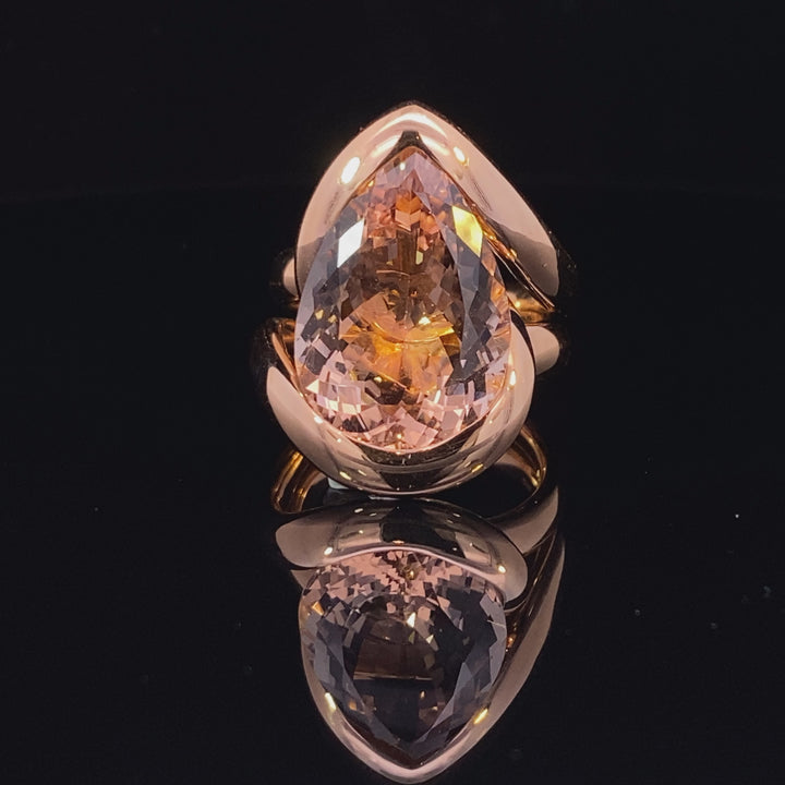 Pear shaped champagne peach coloured morganite ring in infinity design in rose gold Pear shaped champagne peach coloured morganite ring in infinity design in rose gold video