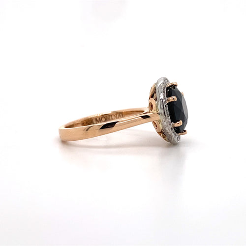 side view of the Round brilliant cut black sapphire diamond halo ring on rose gold band.