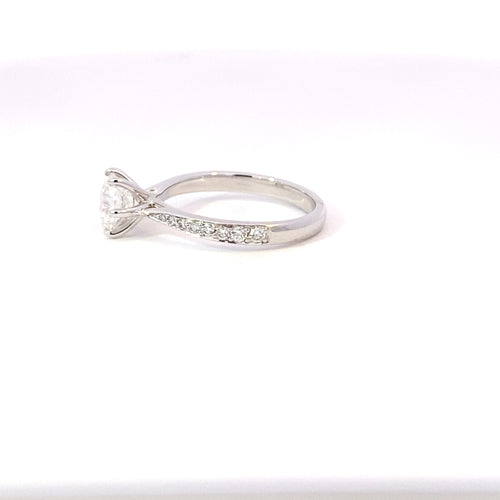 Round brilliant cut diamond solitaire with diamond set band