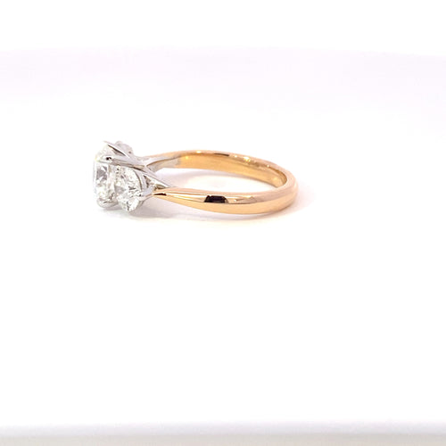 Trilogy round brilliant cut diamond ring on rose gold band