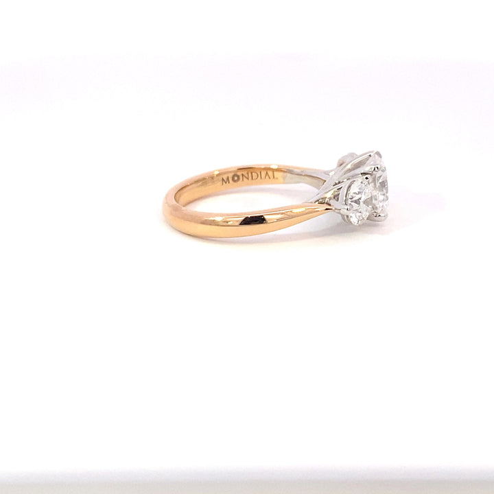 Trilogy round brilliant cut diamond ring on rose gold band