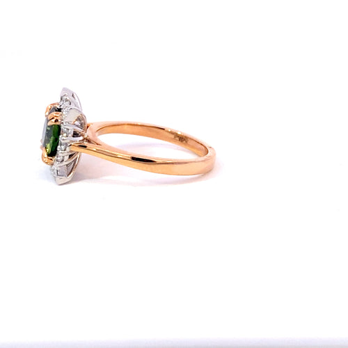 Round brilliant cut green sapphire diamond halo ring on rose gold band