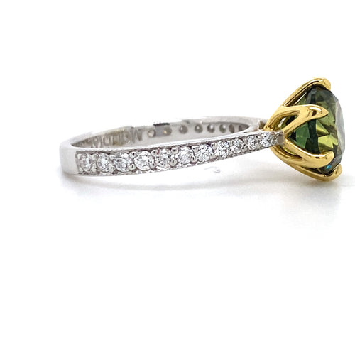 Round brilliant cut green Australian Parti sapphire ring with diamond band