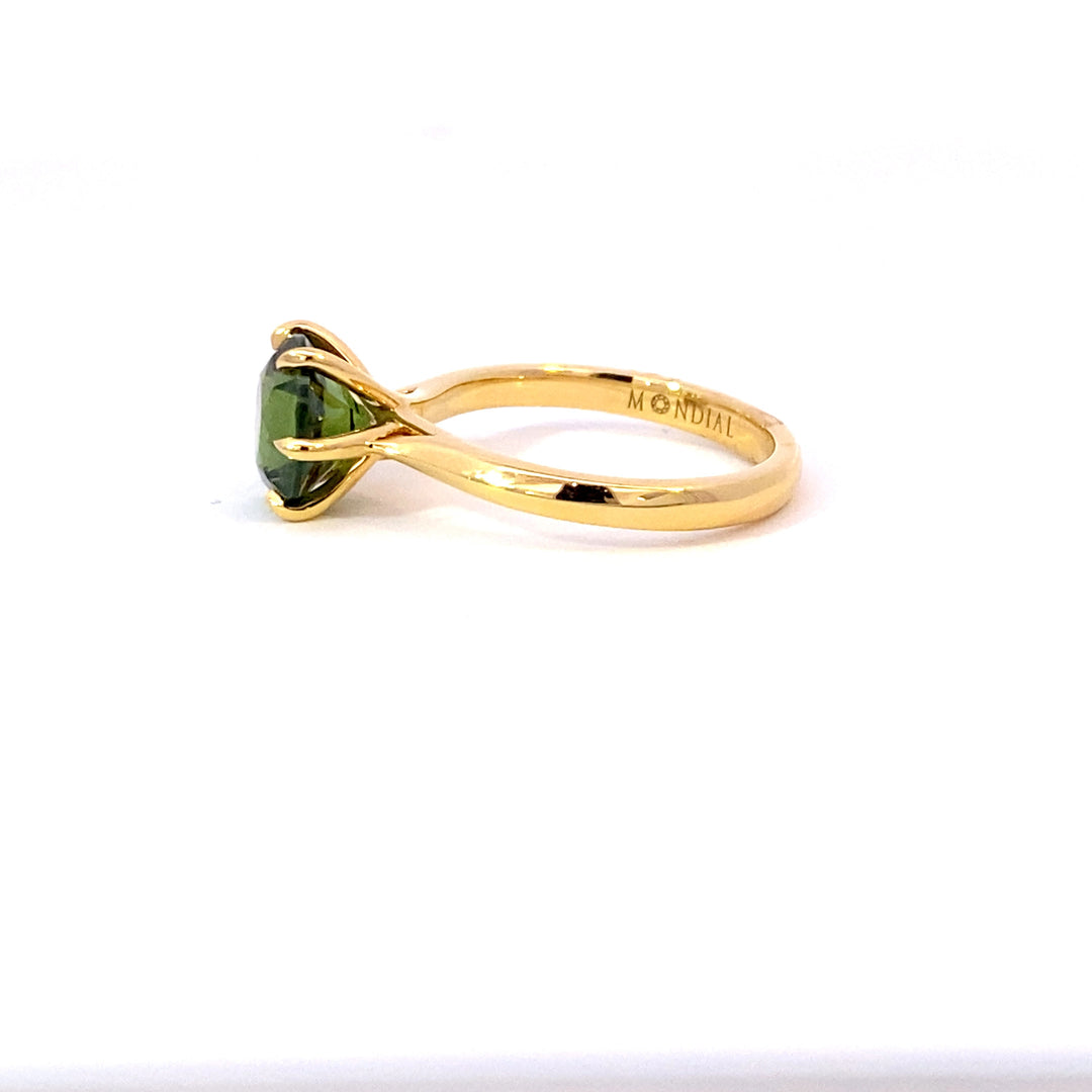 Round brilliant cut green sapphire ring on rose gold band