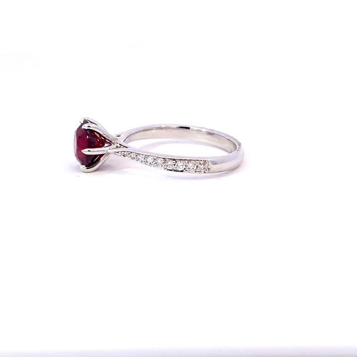 Round brilliant cut ruby ring with diamond band