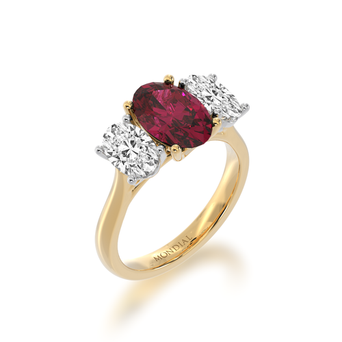 Trilogy oval cut ruby and diamond ring on yellow gold band  view from angle.