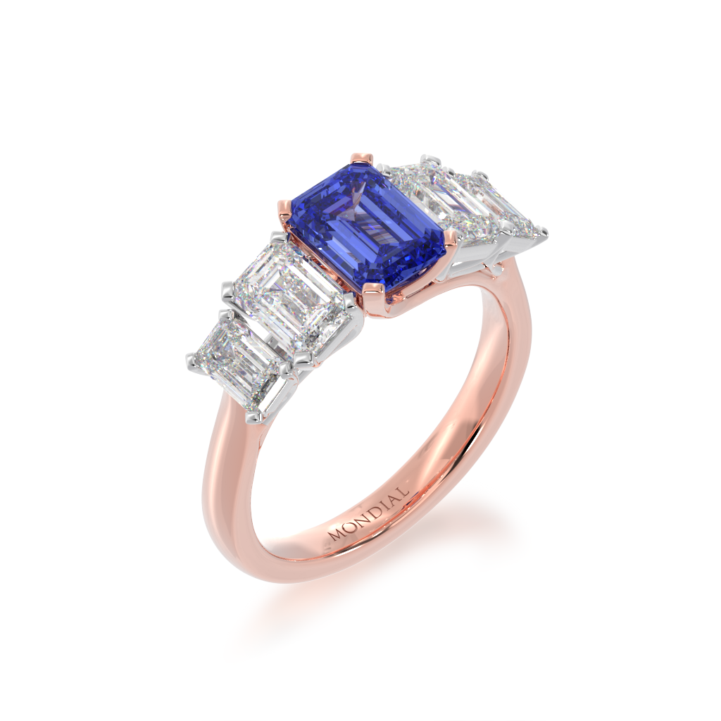5 stone Emerald cut Blue Sapphire and diamond ring on angle 