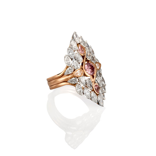 Rose gold multi piece ring with 28 white diamonds and 3 pink sapphires. The ring is photographed from the side on a high gloss white background