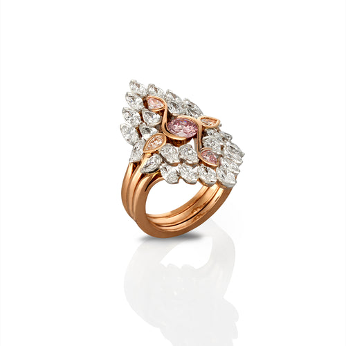 Rose gold multi piece ring with 28 white diamonds and 3 pink sapphires. The ring is photographed from the top left side