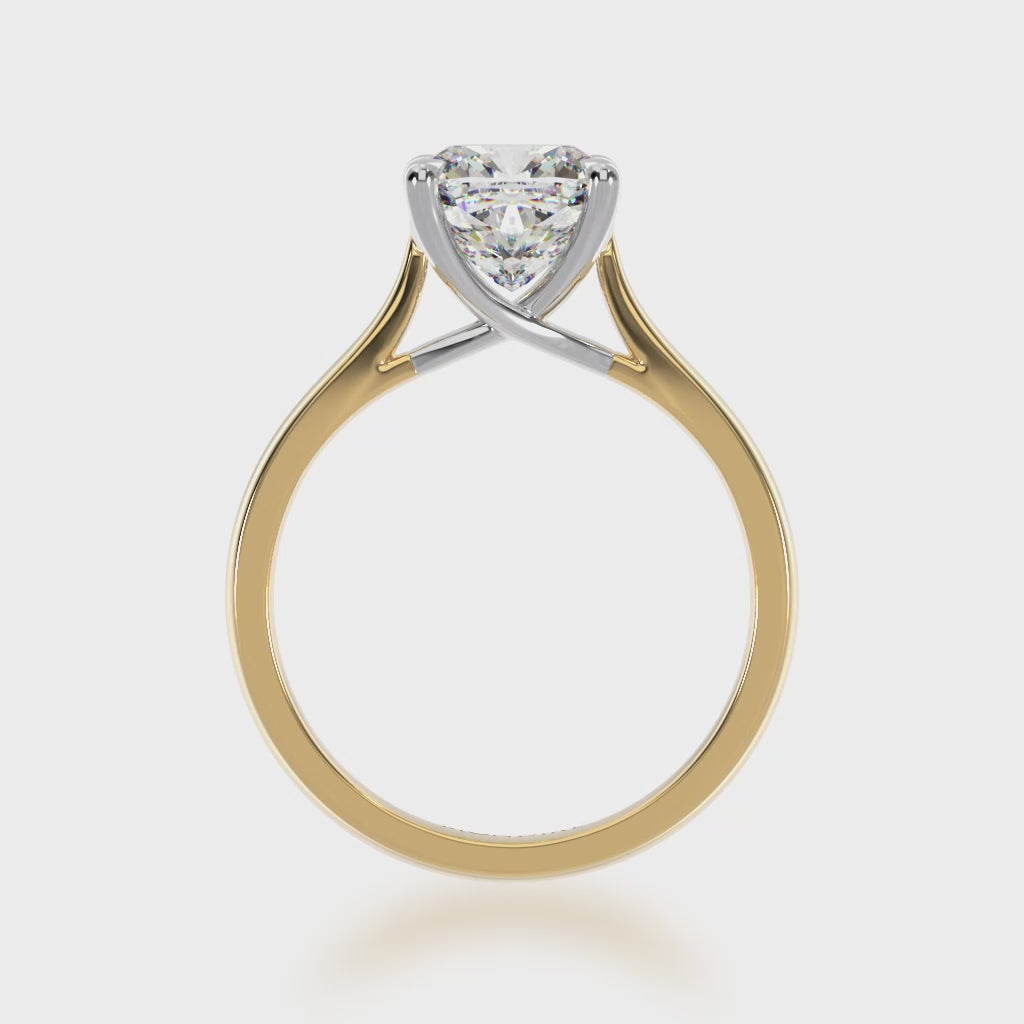 Cushion cut diamond solitaire ring on yellow gold band 3d video