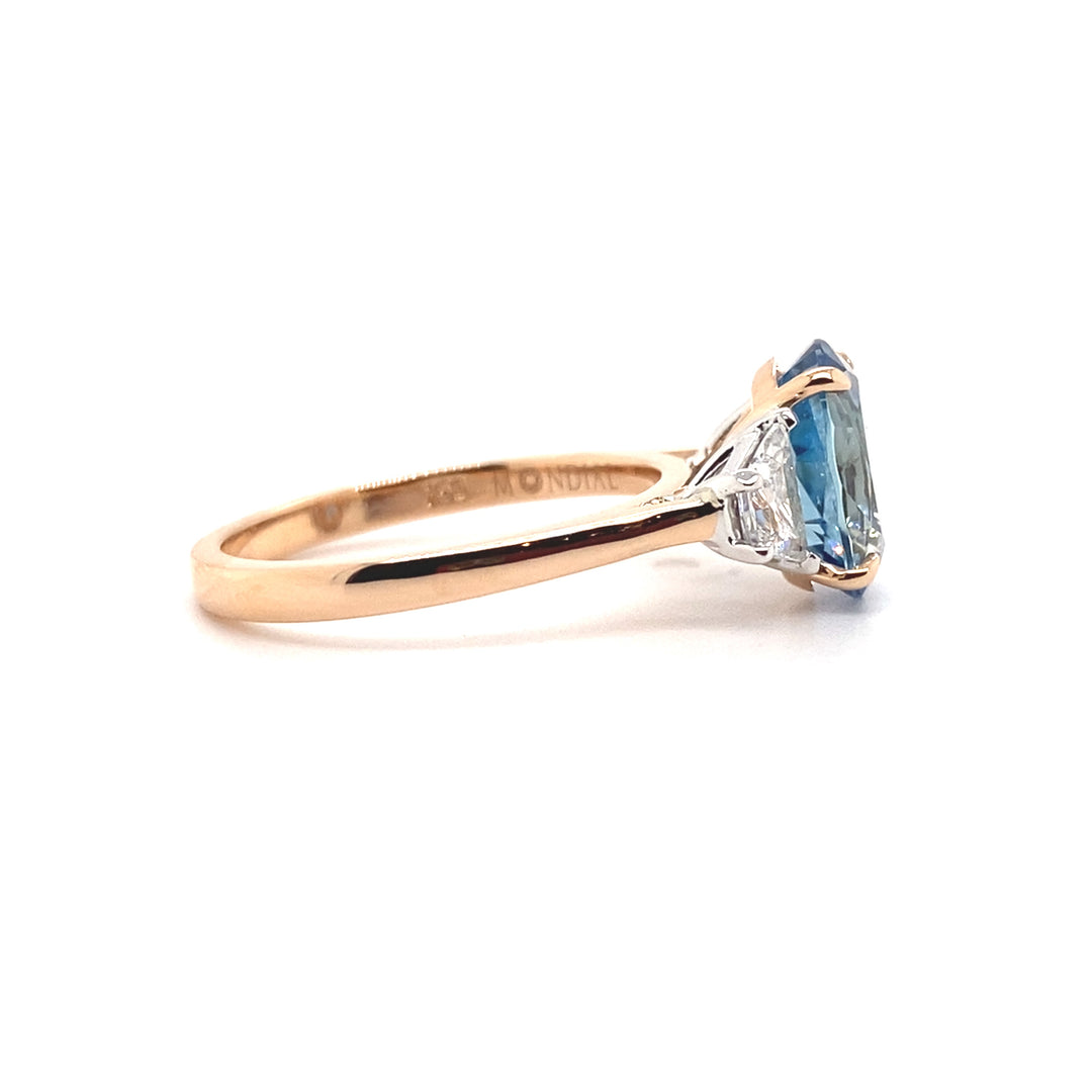 Trilogy oval cut aquamarine and diamond ring on rose gold band