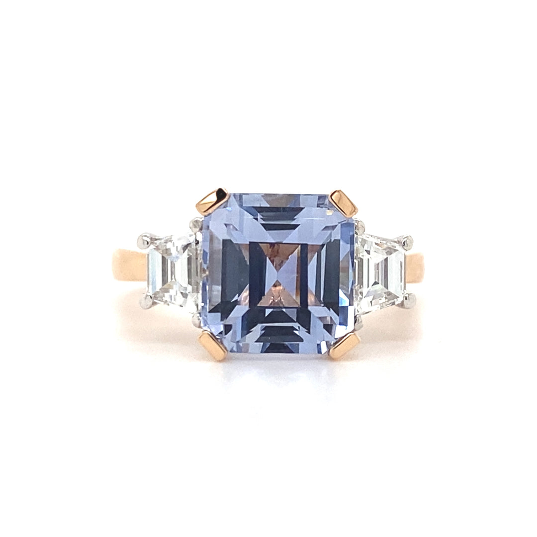 Trilogy square cut blue sapphire and diamond ring on rose gold band