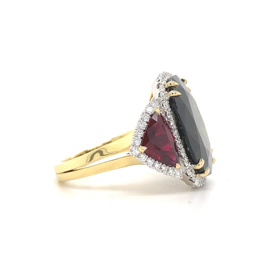 Trilogy cushion cut black sapphire and ruby ring on rose gold band