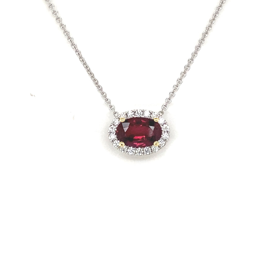 Oval cut ruby and diamond halo pendant view from front 