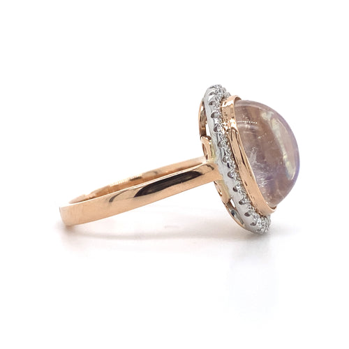 Oval cut moonstone diamond halo ring on rose gold band