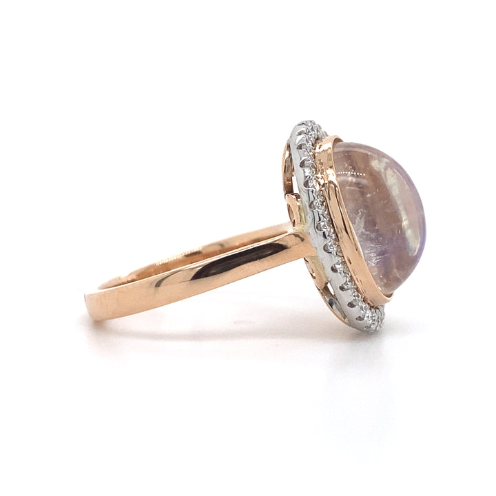 Oval cut moonstone diamond halo ring on rose gold band