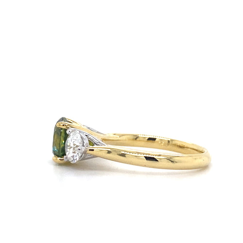 Trilogy round brilliant cut green parti sapphire and diamond ring on yellow gold band