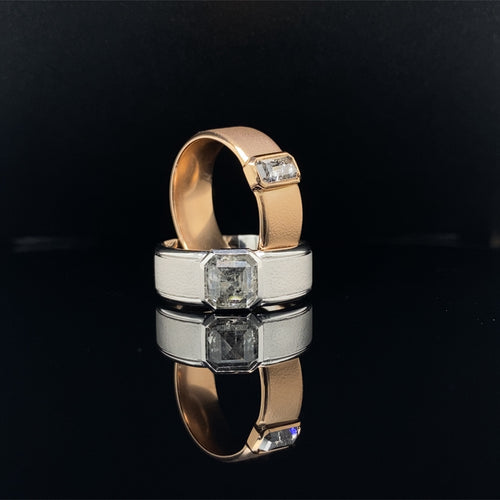 Two Salt and Pepper Diamond Rings crafted from 18ct rose gold and white gold with the rose gold ring sitting inside the white gold ring.