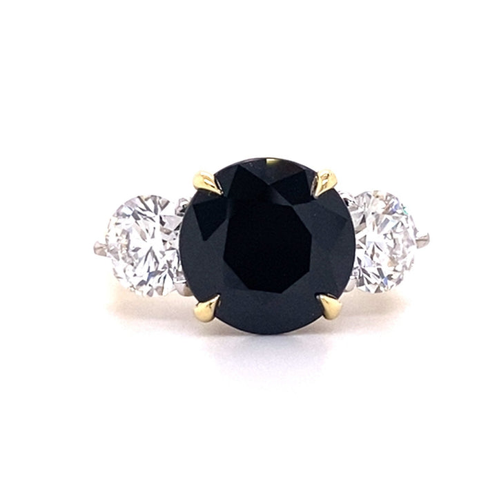Trilogy round brilliant cut black sapphire and diamond ring on rose gold band