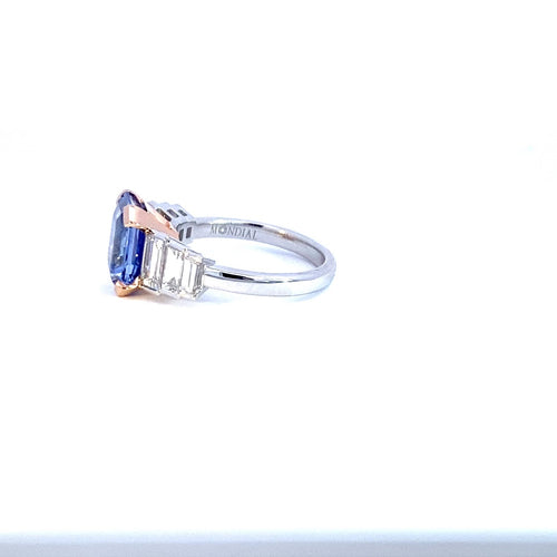 Side view of the Manhattan design radiant cut sapphire and diamond ring on white gold band engagement ring by Mondial by Nadia on a white background.