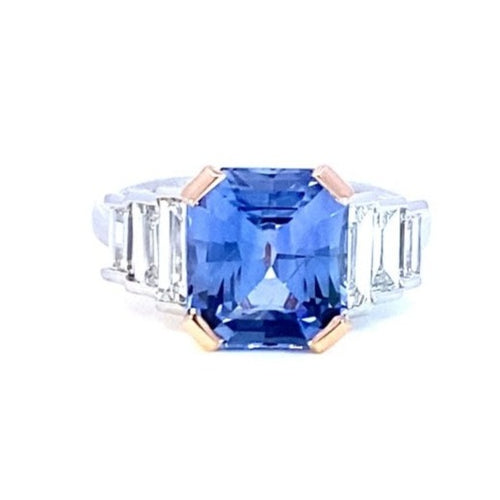 Front view of the Manhattan design radiant cut sapphire and diamond ring on white gold band engagement ring by Mondial by Nadia on white background.