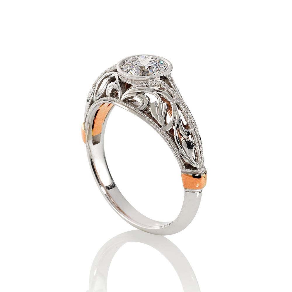 Round brilliant cut diamond filigree design ring on white gold band