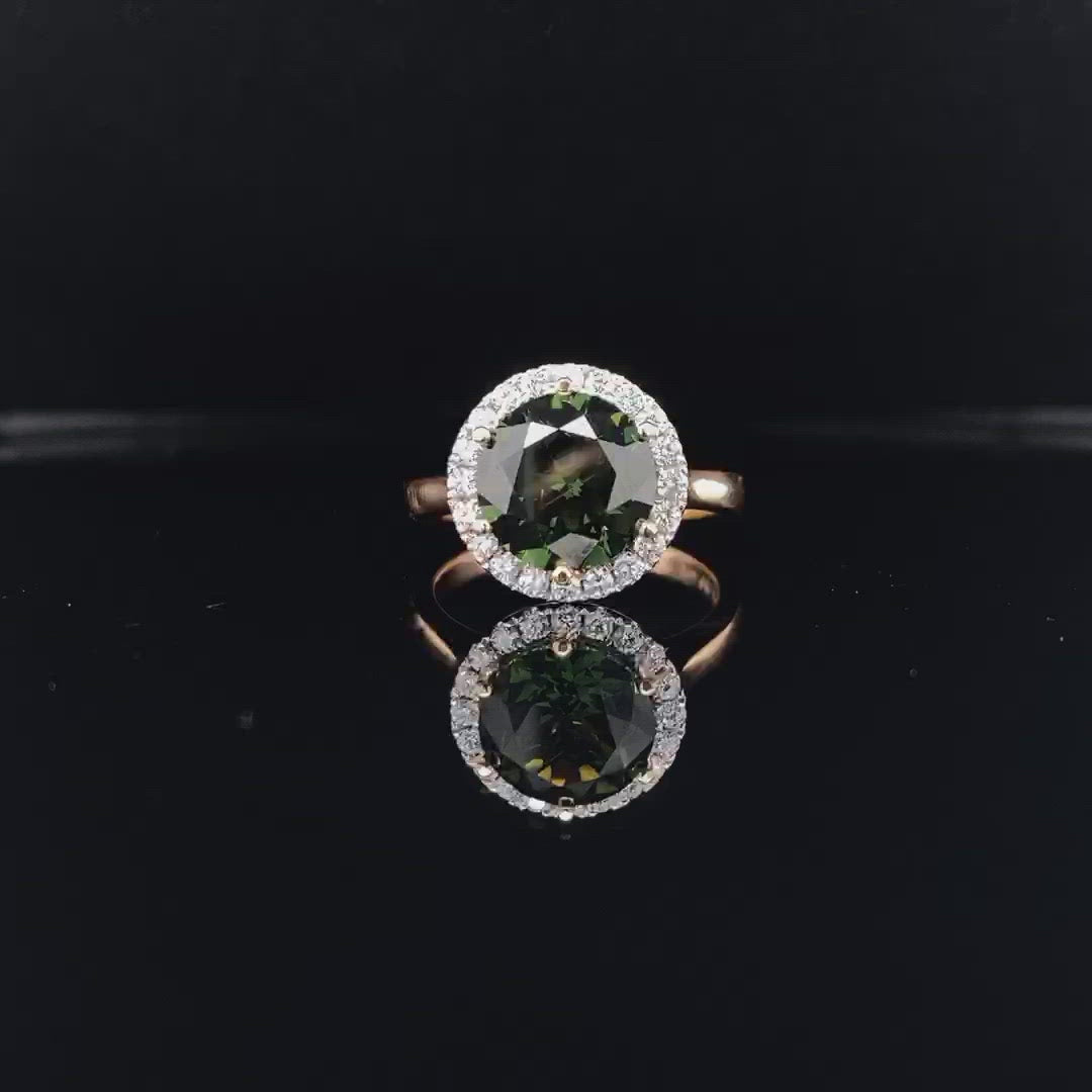 Round brilliant cut green sapphire diamond halo ring on rose gold band