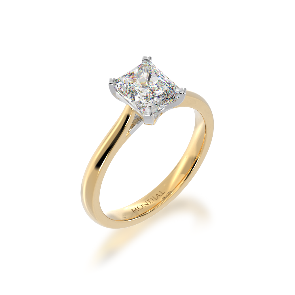 Radiant cut diamond solitaire on yellow gold band view from an angle