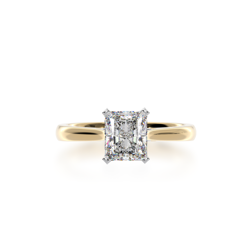 Radiant cut diamond solitaire ring on yellow gold band view from top