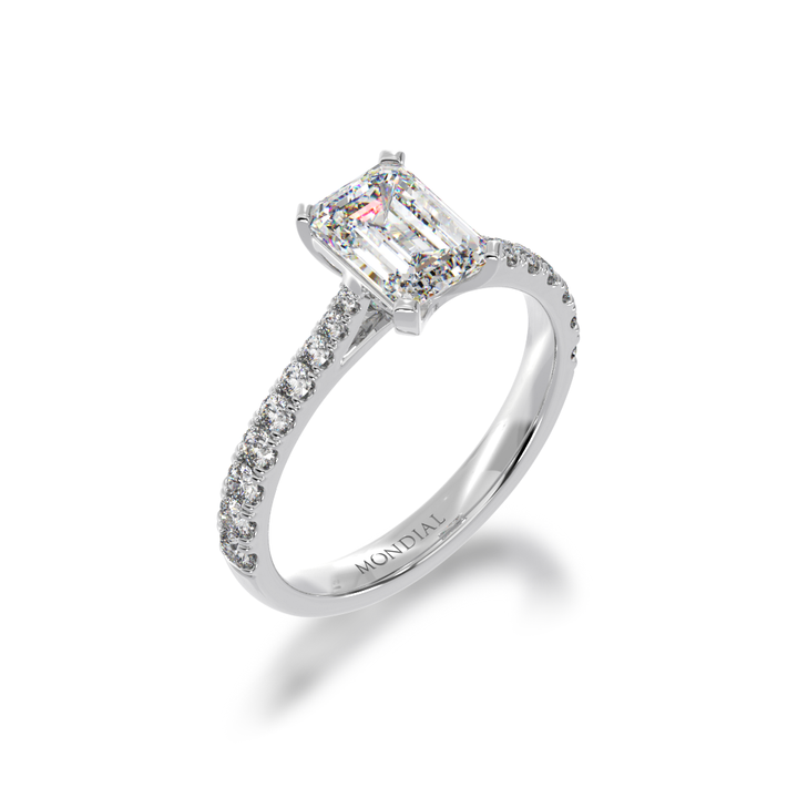 Emerald cut Diamond Solitaire with a white gold diamond set band from angle