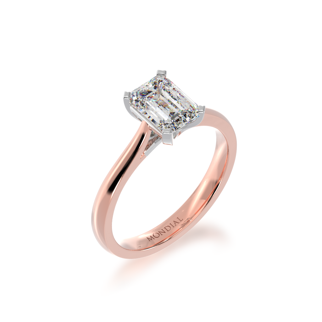 Emerald cut solitaire diamond ring on rose gold band view from angle 