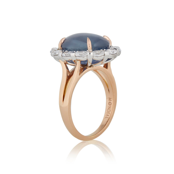 Oval cut cabochon star sapphire diamond halo ring on rose gold band