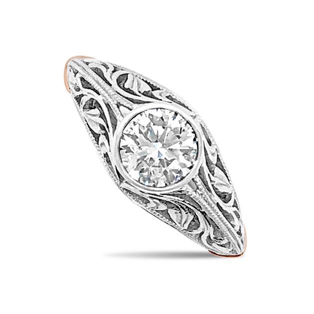 Round brilliant cut diamond filigree design ring on white gold band