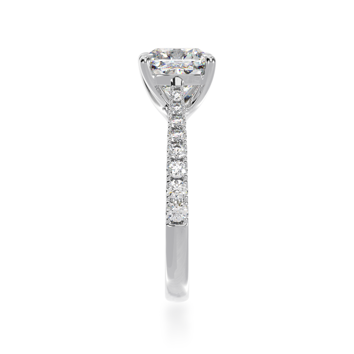 Cushion cut white diamond solitaire with a white gold claw set diamond band from side