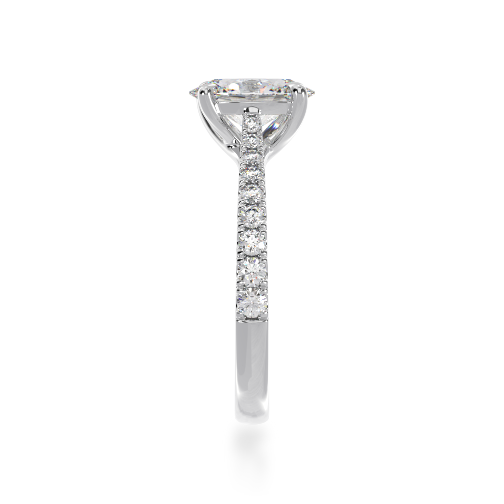 Oval cut diamond solitaire with a white gold diamond set band from side view