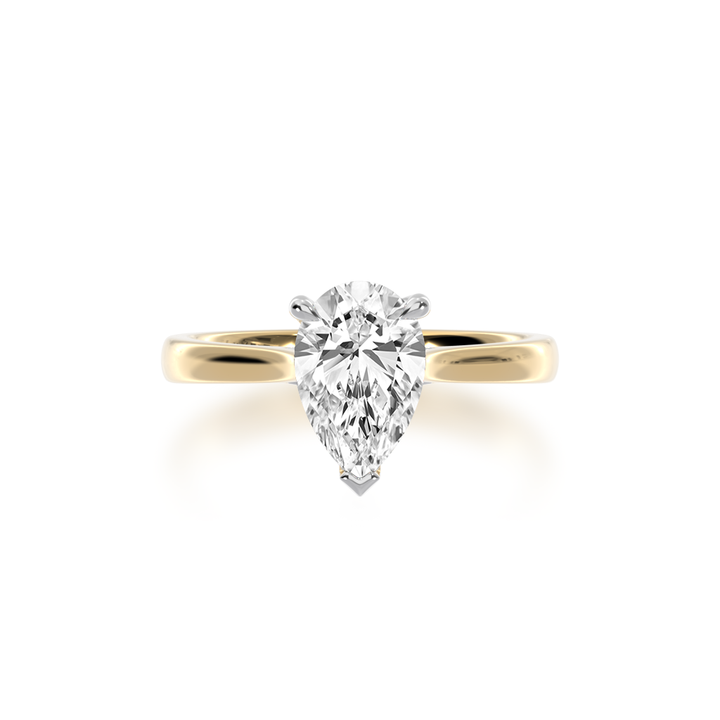 Pear shaped diamond solitaire ring on yellow gold band view from top