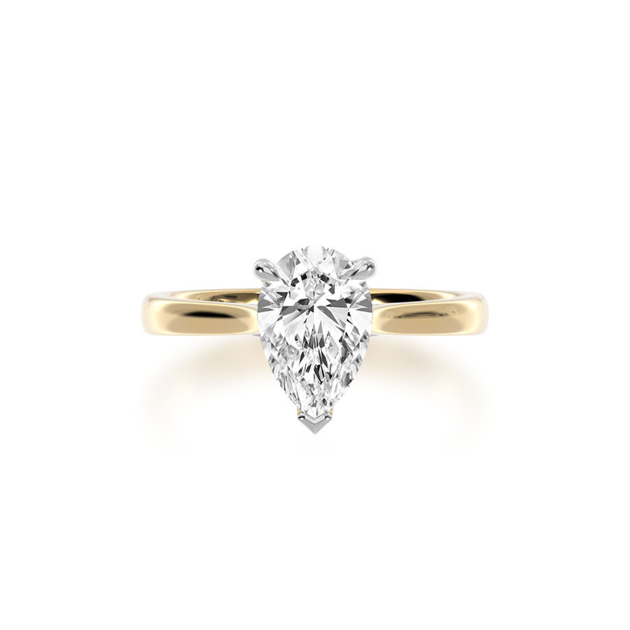 Pear shaped diamond solitaire ring on yellow gold band view from top