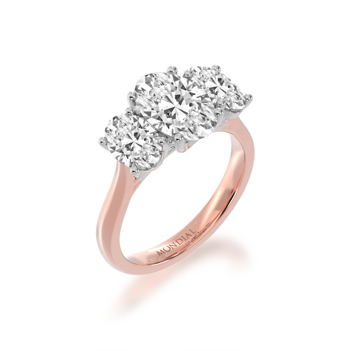 Trilogy oval diamond ring on rose gold band view from angle.