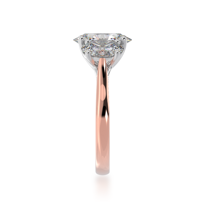 Trilogy oval cut diamond ring on rose gold band view from side 