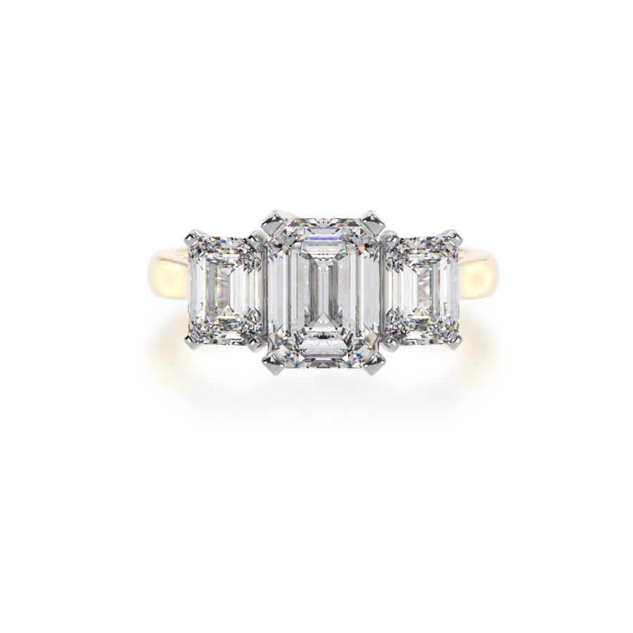 Trilogy emerald cut diamond ring on yellow gold band view from top