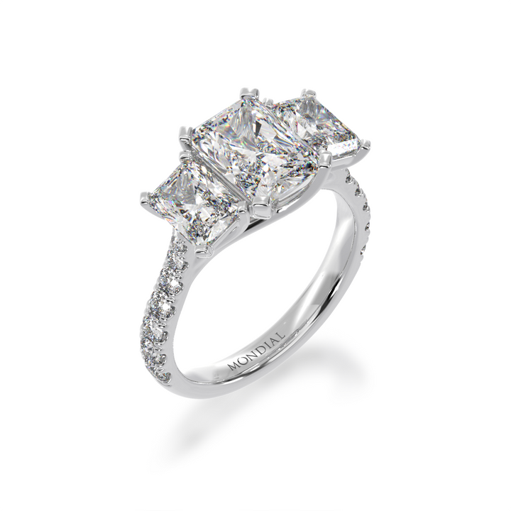 White Gold Trilogy radiant cut diamond ring with a diamond band on angle