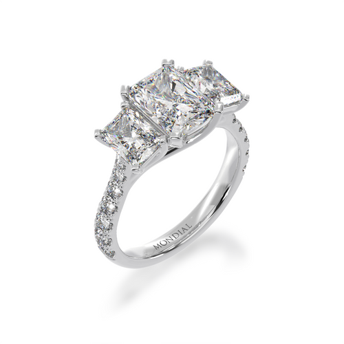 White Gold Trilogy radiant cut diamond ring with a diamond band on angle