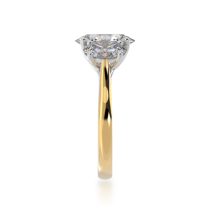 Trilogy oval cut diamond ring on yellow gold band