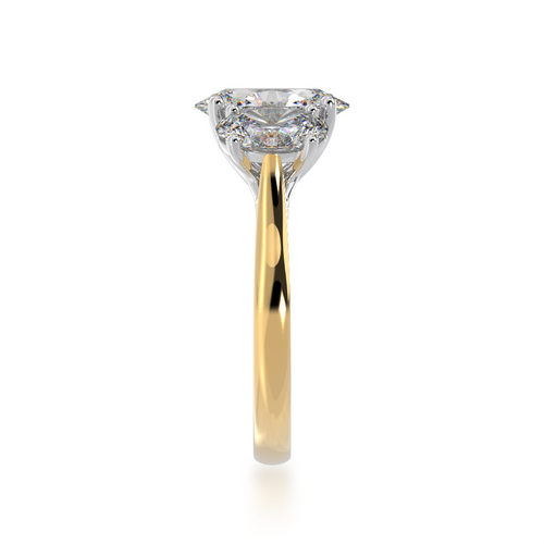 Standing side view of the Trilogy oval cut diamond ring on yellow gold band.